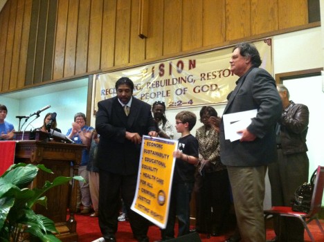 Barber speaking to activists