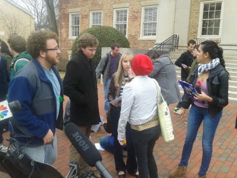 Landen Gambill at a rally in front of the South Building on UNC's campus.