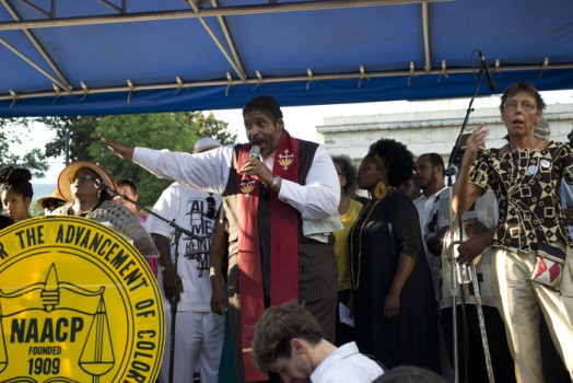 Rev. Barber addressing the crowd in front of the Capital Building; Photo by Alex Curley
