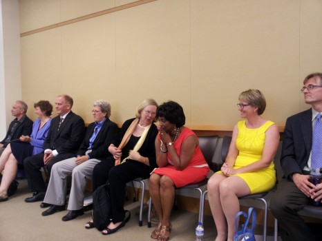 Valerie Foushee, (in red), upon hearing the committee's decision to appoint her to the N.C. Senate.